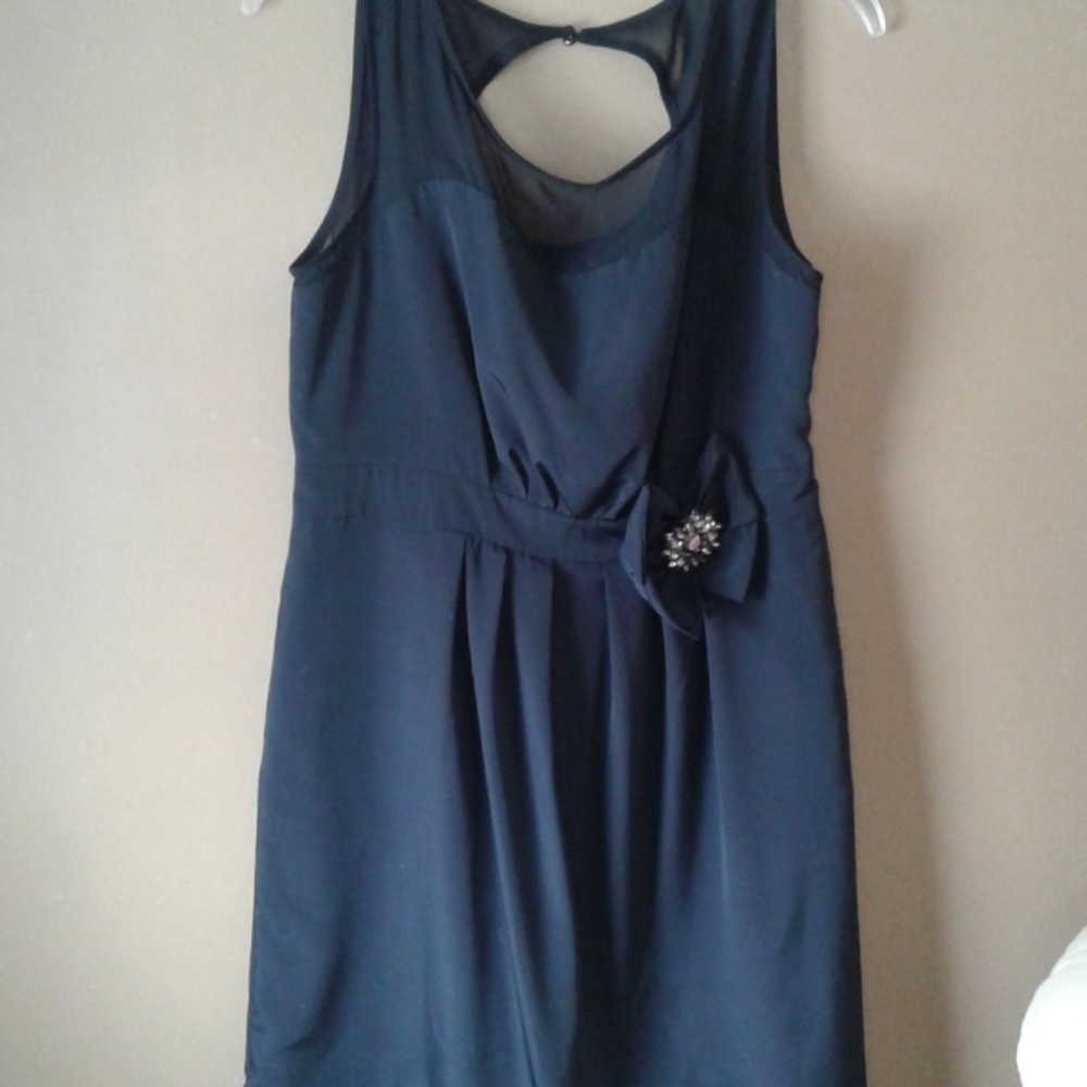 Black semi-formal, above the knee dress.
